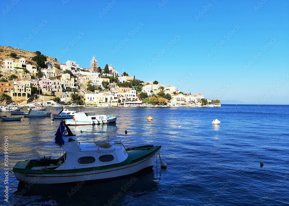 Small boats in the harbor of Symi island, Greece.