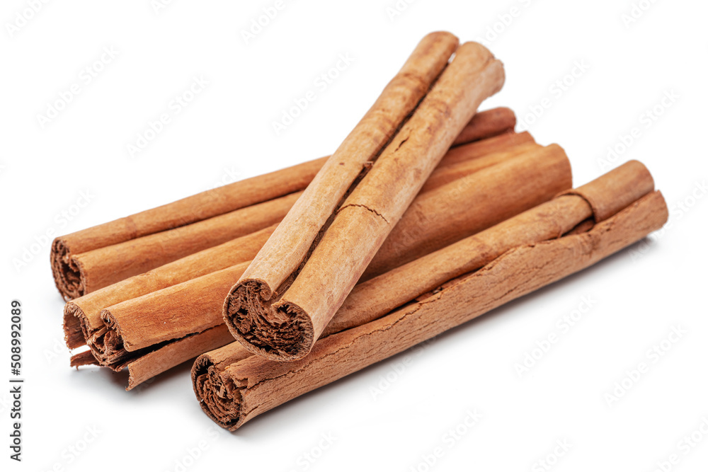 Cinnamon dried bark strips, sweet-smelling brown substance used in cooking, isolated on white background.