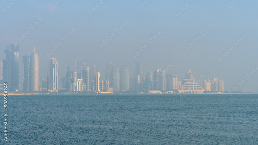 view of Westbay area with many iconic towers and builidings on misty day morning