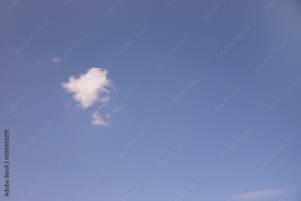 White clouds in the blue sky.