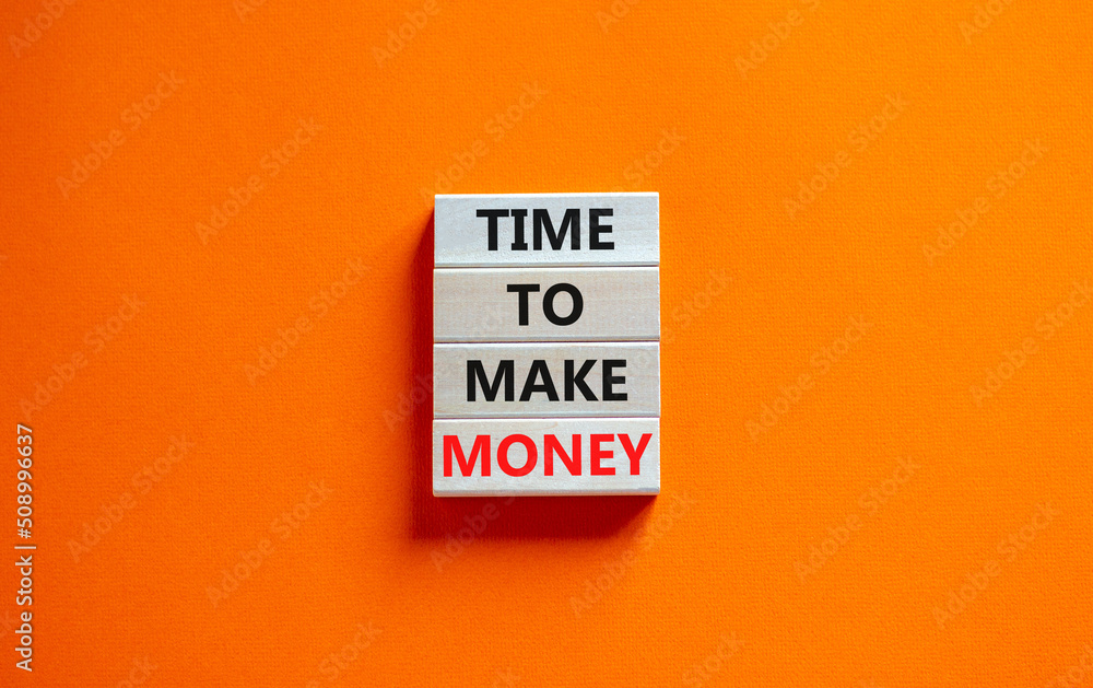 Time to make money symbol. Concept words Time to make money on wooden blocks on a beautiful orange table orange background. Business, finacial and time to make money concept. Time to make money symbol. Concept words Time to make money on wooden blocks on a beautiful orange table orange background. Business, finacial and time to make money concept.