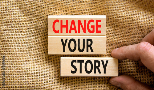 Change your story symbol. Concept words Change your story on wooden blocks on a beautiful canvas table canvas background. Businessman hand. Business finacial and change your story concept. Copy space. photo