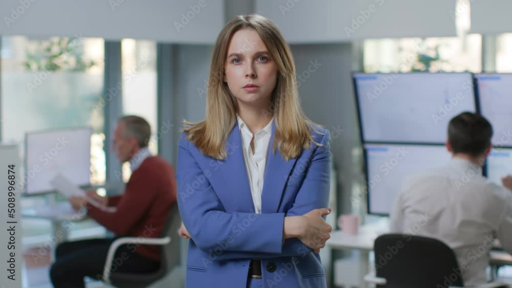 Portrait of serious businesswoman looking at camera with arms crossed Portrait of serious businesswoman looking at camera with arms crossed