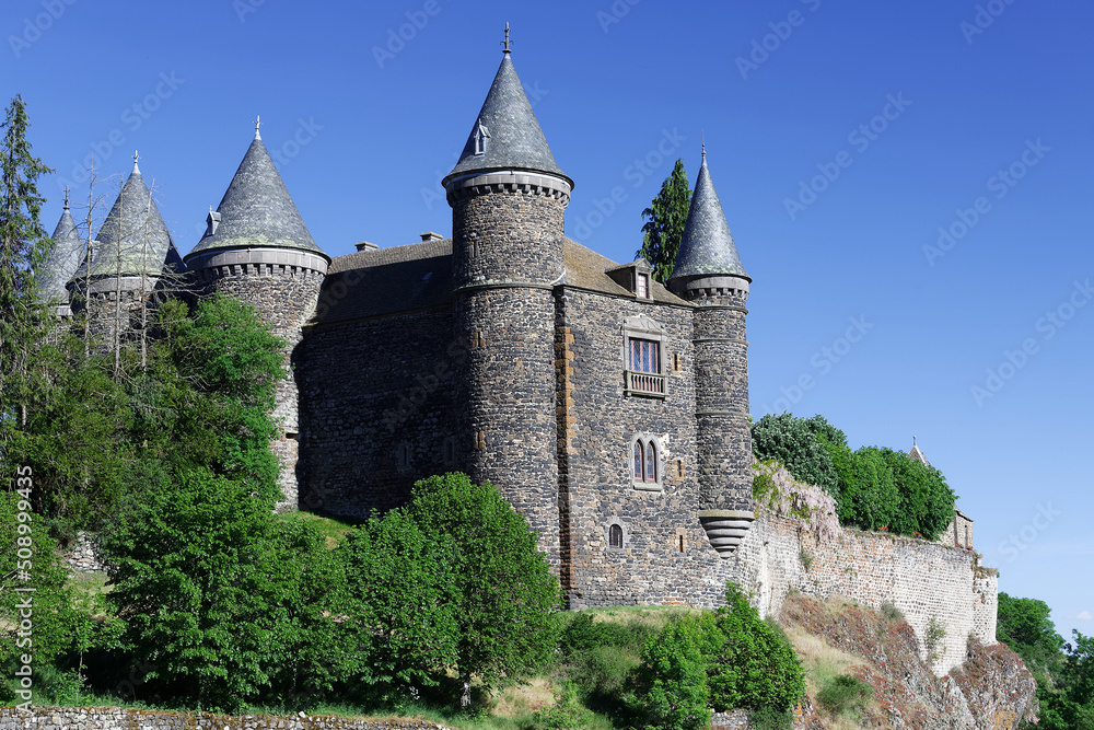 Located in the heart of the Auvergne volcanoes, the 1000-year-old Sailhant castle towers over a spectacular rocky outcrop .
