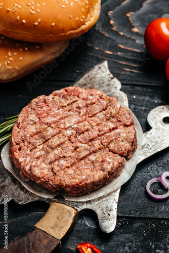 hamburger patties, minced meat for burger, beef lamb meat Burger steak on a wooden background, vertical image. top view. place for text