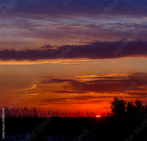 a sunset under the Ukrainian steppe near the Sea of Azov