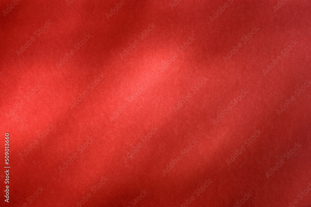 Empty red textured wall with shadows texture and background