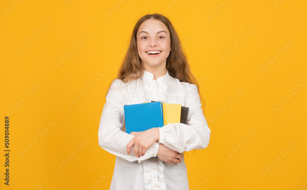 Fototapeta premium childhood education. knowledge day. kid hold notebook. student in high school.