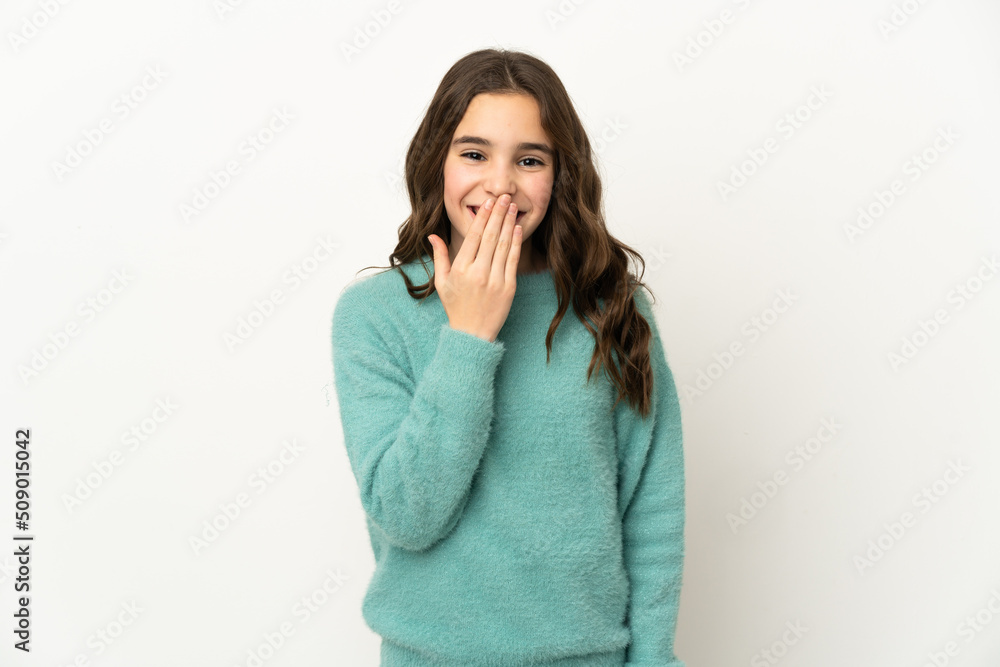 Little caucasian girl isolated on white background happy and smiling covering mouth with hand Little caucasian girl isolated on white background happy and smiling covering mouth with hand