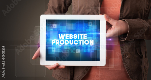 Wallpaper Mural Person holding tablet, technology concept Torontodigital.ca