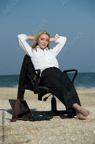 Business woman on the beach