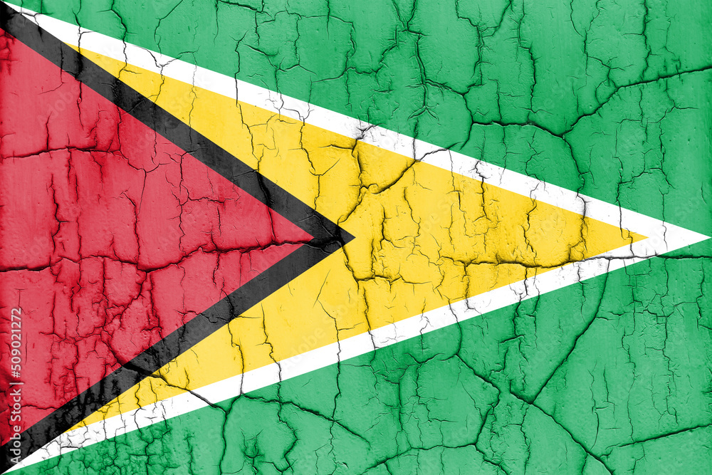 Textured photo of the flag of Guyana with cracks.