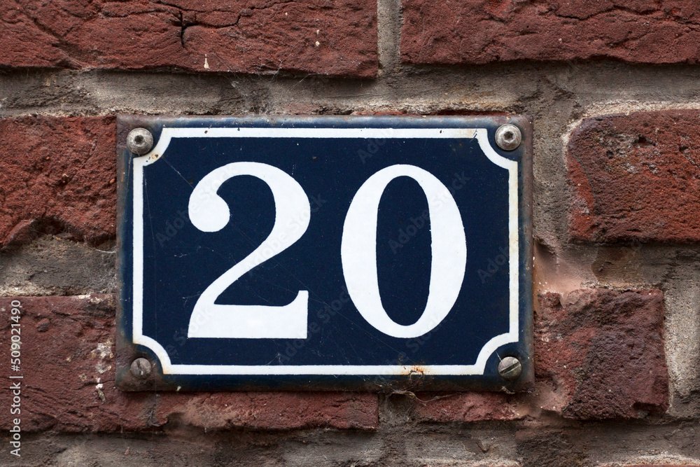 House number sign on a brick wall House number sign on a brick wall