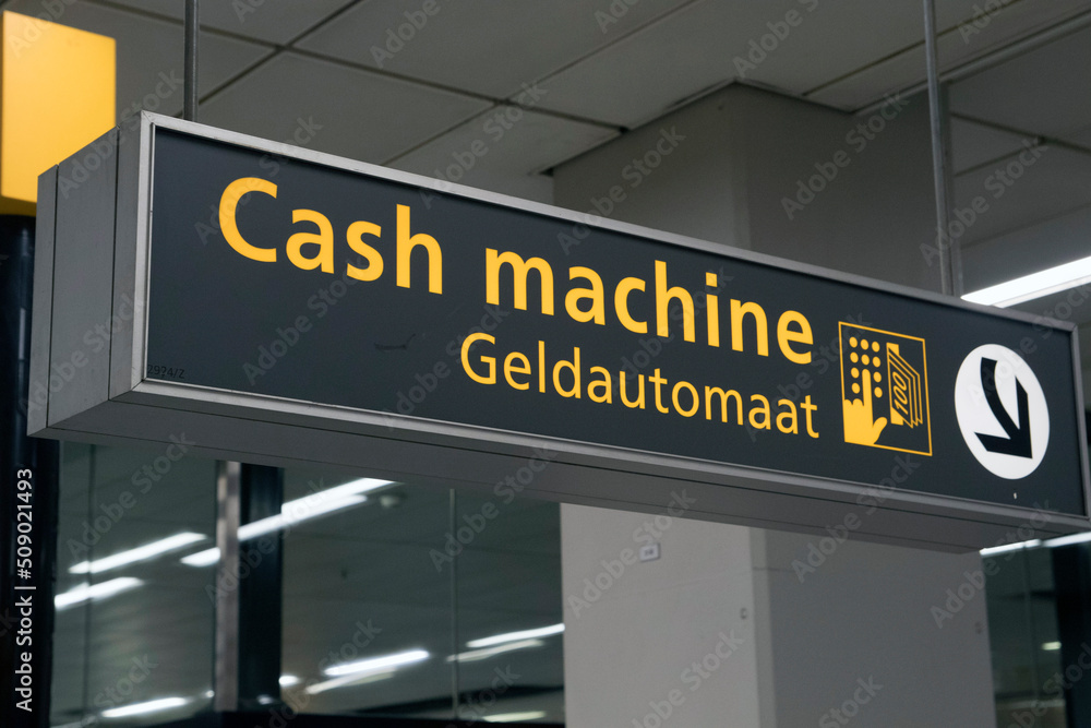 Cash machine information sign reference on a airport Cash machine information sign reference on a airport