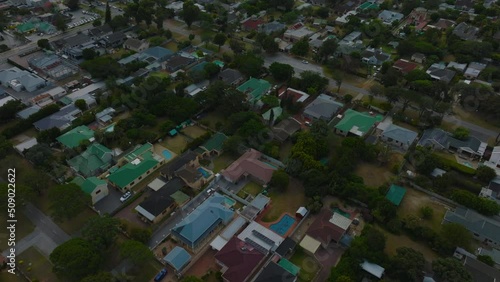 High angle view of residential urban borough. Forwards fly above dense development. Port Elisabeth, South Africa