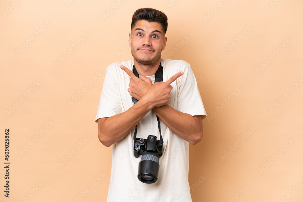 Young photographer caucasian man isolated on beige background pointing to the laterals having doubts Young photographer caucasian man isolated on beige background pointing to the laterals having doubts