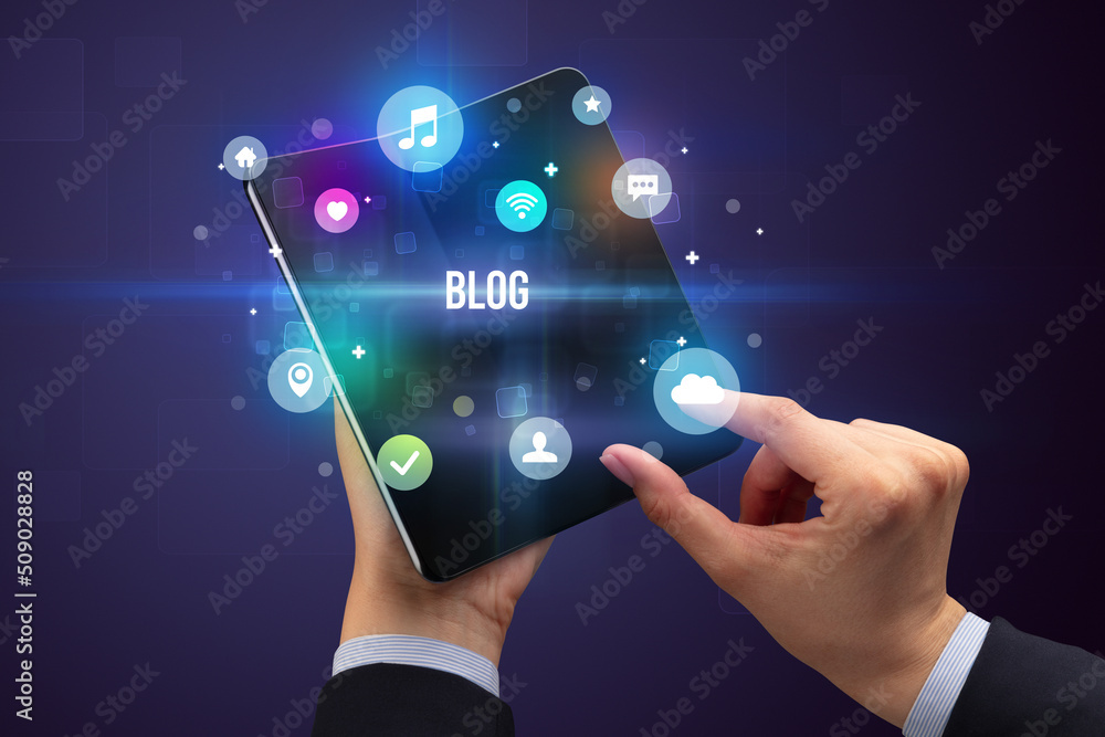 Obraz premium Businessman holding a foldable smartphone