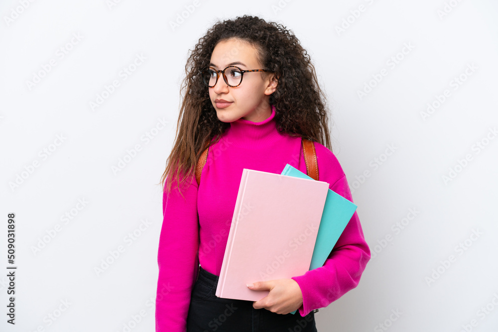 Obraz premium Young student Arab woman isolated on white background looking to the side