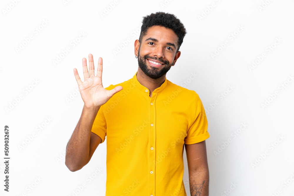 Young Brazilian man isolated on white background counting five with fingers Young Brazilian man isolated on white background counting five with fingers