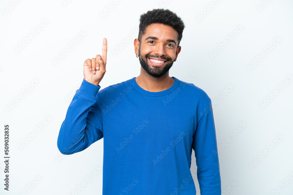 Young Brazilian man isolated on white background pointing up a great idea Young Brazilian man isolated on white background pointing up a great idea