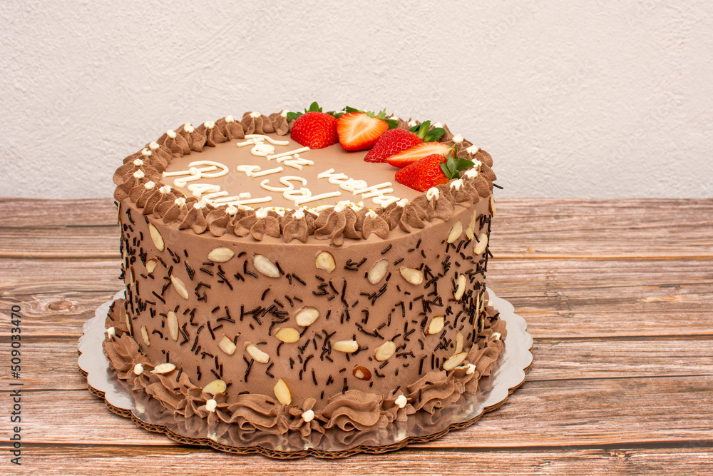 Chocolate cake decorated with strawberries.