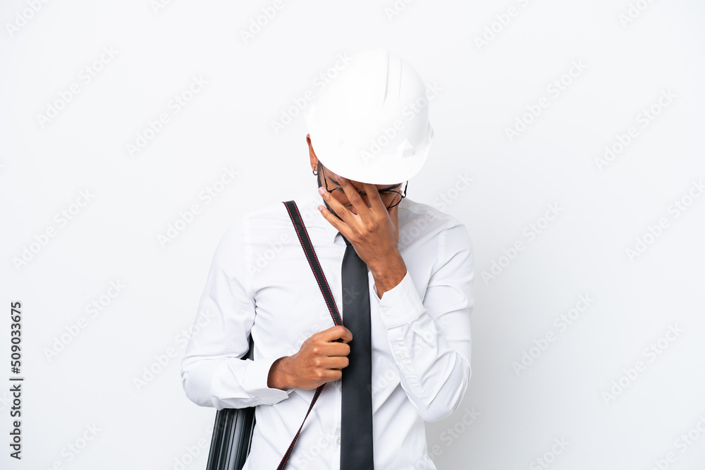 Young architect Brazilian man with helmet and holding blueprints isolated on white background with tired and sick expression Young architect Brazilian man with helmet and holding blueprints isolated on white background with tired and sick expression