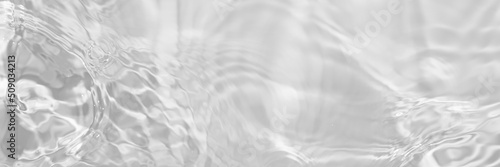 Water texture with sun reflections on the water overlay effect for photo or mockup. Organic light gray drop shadow caustic effect with wave refraction of light. Long banner with copy space
