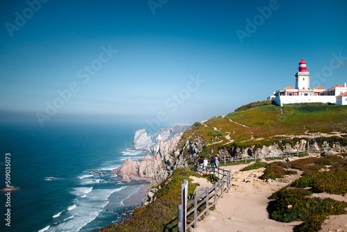 View of the Cabo da Roca Lighthouse. Sintra, Portugal. Portuguese Farol de Cabo da Roca is a cape which forms the westernmost point Eurasian land mass. photo