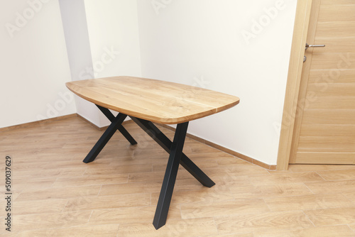 wooden table with black legs