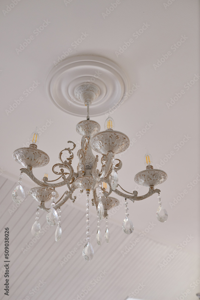 Ceiling luminous chandelier in the interior Ceiling luminous chandelier in the interior