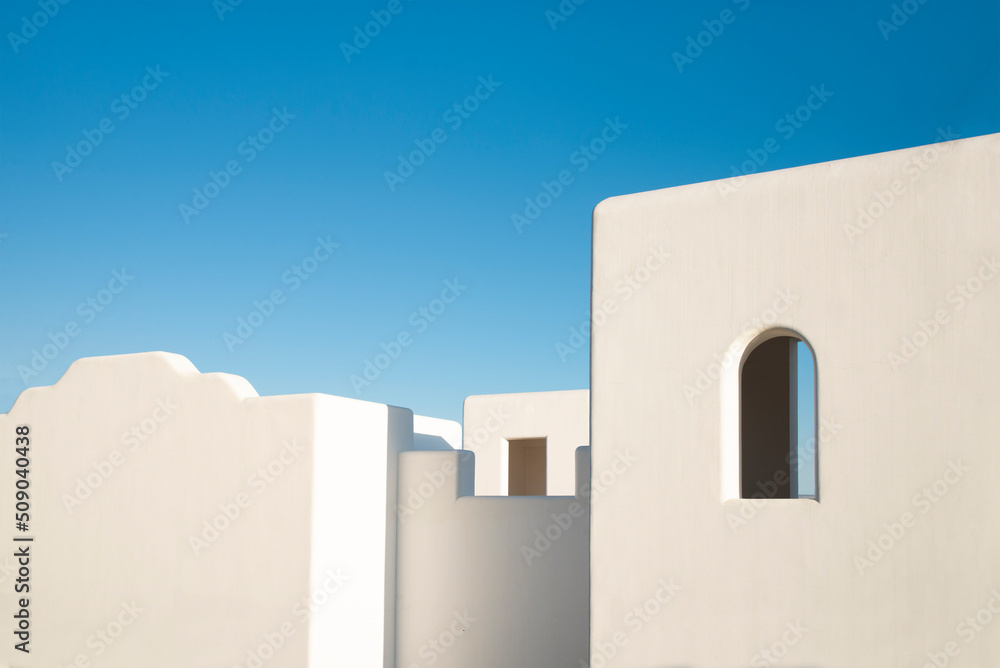 Surreal roof and window in typical mediterranean style building with white walls and blue sky, beautiful wallpaper. Surreal roof and window in typical mediterranean style building with white walls and blue sky, beautiful wallpaper.