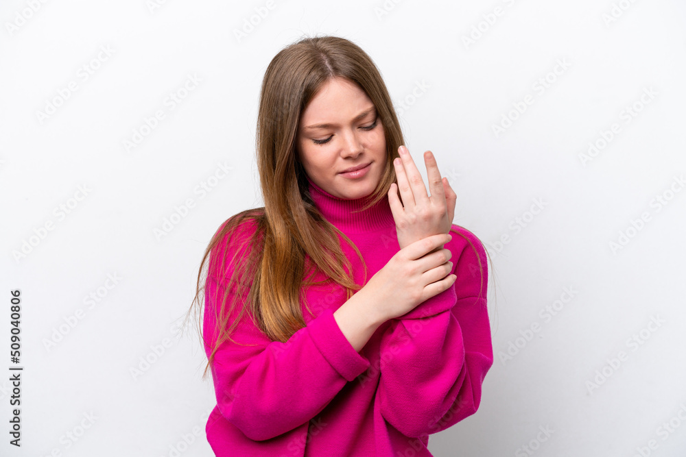 Young caucasian woman isolated on white background suffering from pain in hands Young caucasian woman isolated on white background suffering from pain in hands