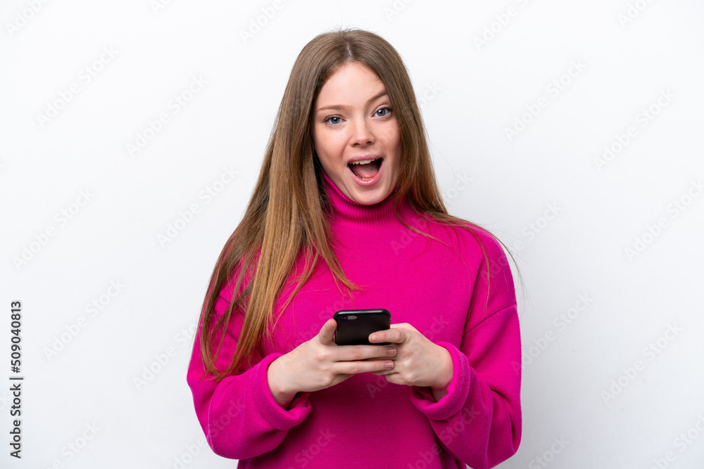 Young caucasian woman isolated on white background surprised and sending a message Young caucasian woman isolated on white background surprised and sending a message