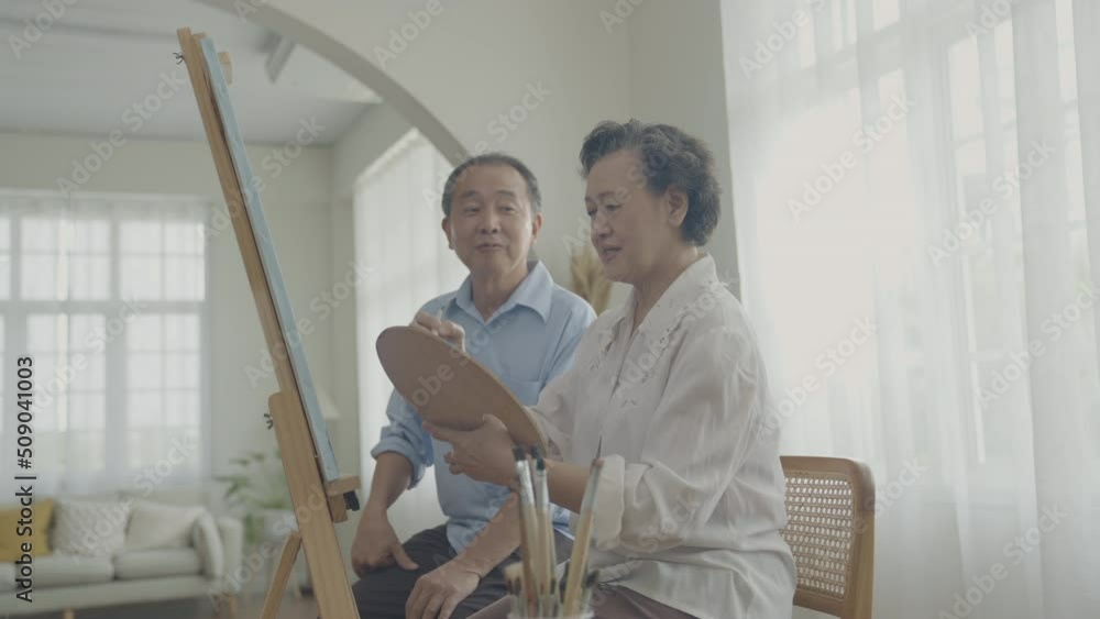 Artist concept of 4k Resolution. Asian families drawing together in the living room. Artist is creating work. Leisure activities and hobbies. Artist concept of 4k Resolution. Asian families drawing together in the living room. Artist is creating work. Leisure activities and hobbies.