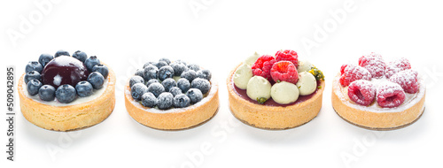 Delicious cakes with fresh berries - blueberries, raspberries isolated on white background