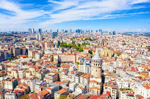 Aerial drone view of Galata Tower and business district in Istanbul, Turkey. Summer sunny day