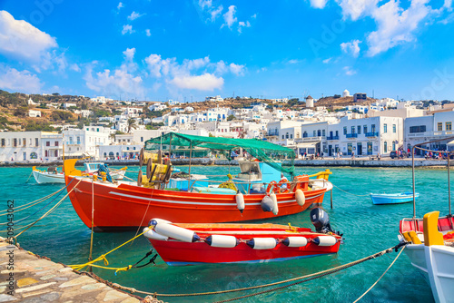 Chora port of Mykonos island with ships, yachts and boats during summer sunny day. Aegean sea, Greece