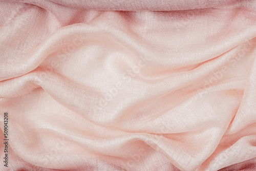 Pastel pink cloth background. Fabric wrinkled and soft wave. Abstract background