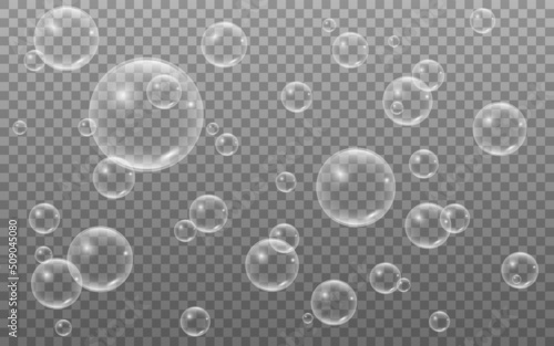 Bubbles on transparent backdrop. Realistic soap bubble. Water balls with reflection. Liquid 3d objects. Glossy round spheres with light effect. Vector illustration