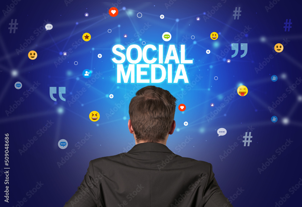 Rear view of a businessman, social media concept Rear view of a businessman, social media concept