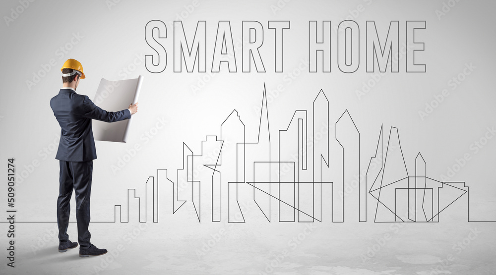 Businessman in hard hat holding blueprint Businessman in hard hat holding blueprint