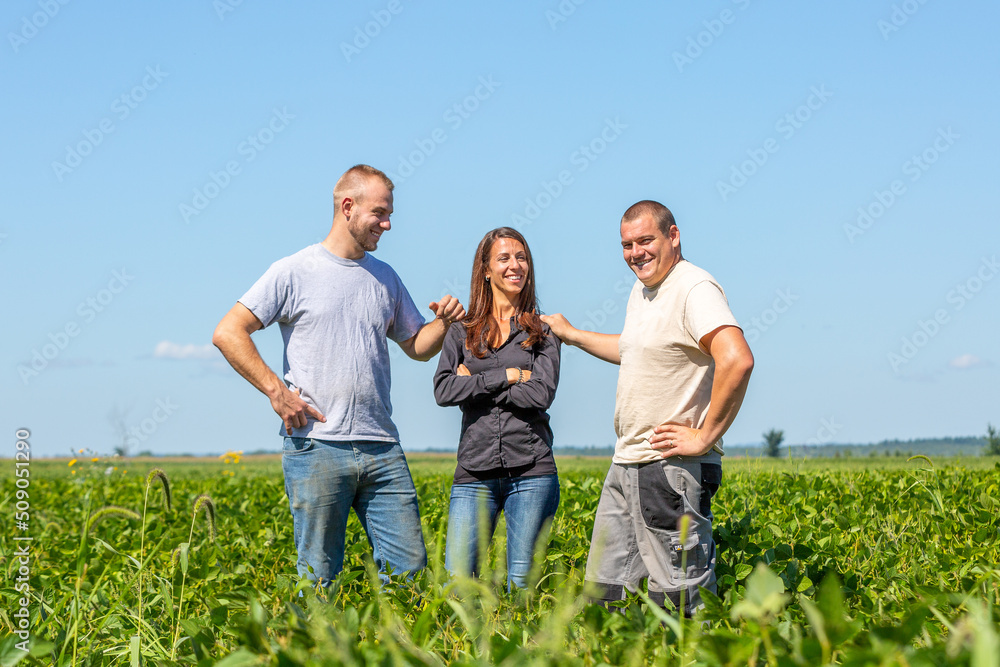 Young modern farming entrepreneurs in a soy field. High quality photo Young modern farming entrepreneurs in a soy field. High quality photo
