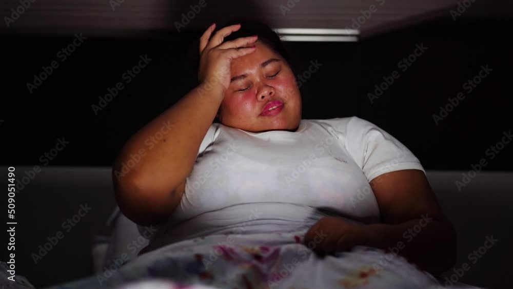 Fat young woman having nightmare in the bedroom Fat young woman having nightmare in the bedroom