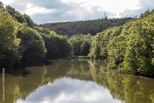 Panorama of a natural lake, on Bela Reka jezero lake, by Ripanj in the southern rural part of Belgrade, Serbia, into the light...