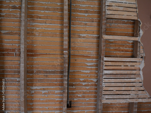 Plaster and lath walls that make great construction and grunge texture for backgrounds or old house photos