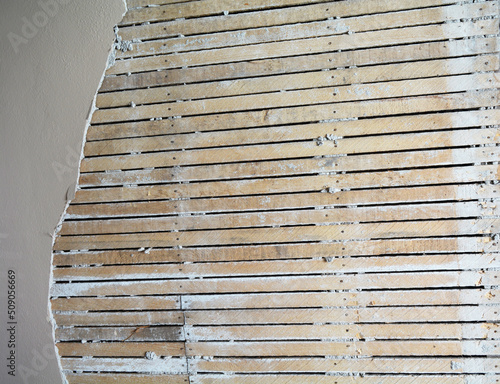 Φωτογραφία Plaster and lath walls that make great construction and grunge texture for backg
