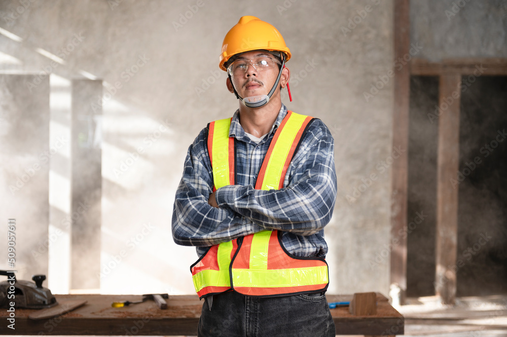 Carpenter working in an Asian carpentry office working portrait of a white man. Carpenter working in an Asian carpentry office working portrait of a white man.