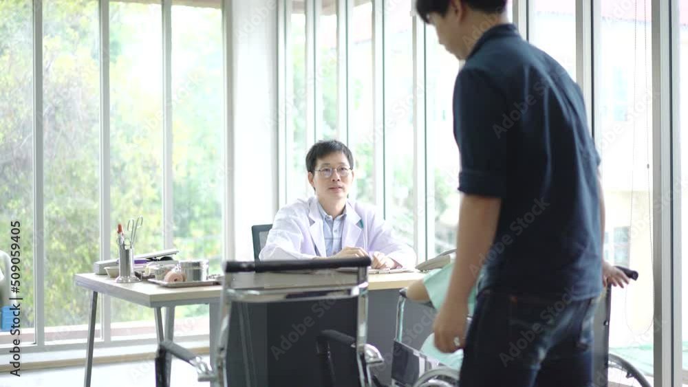 Doctor consulting with young couple in doctor room at hospital Doctor consulting with young couple in doctor room at hospital