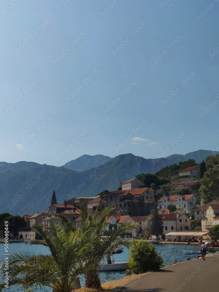 Daytime cityscape with sea and mountains in old town of Perast, Montenegro