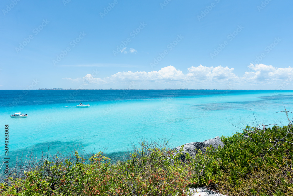 Panoramic sea views with luxury yachts anchored in the bay Garrafon Park, Isla Mujeres in Mexico.